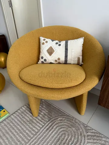Modern mustard yellow accent chair with cushion