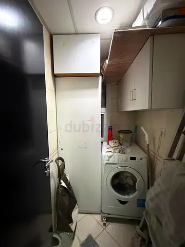 Tall White Utility Cabinet