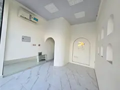 Shop for annual rent in Al Rawda, two floors, excellent finishing, near the Abaya Roundabout, parkin