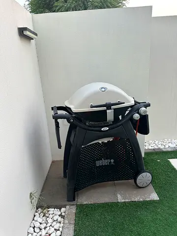 Weber Q3200 Gas barbecue with gas cylinder.