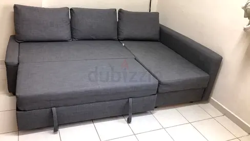 3 seater Grey L-shaped pull-out sofa bed with storage