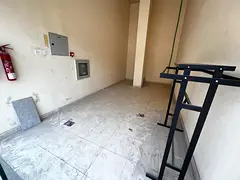 Shop for annual rent in Al Rashidiya 3, opposite Grand Mall, parking available in a prime location,