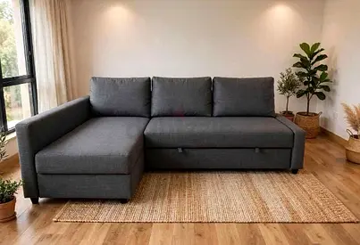 Grey L-shaped 3-seater sofa with storage and chaise - good condition