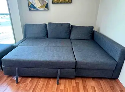 Grey fabric sectional sofa bed with storage chaise
