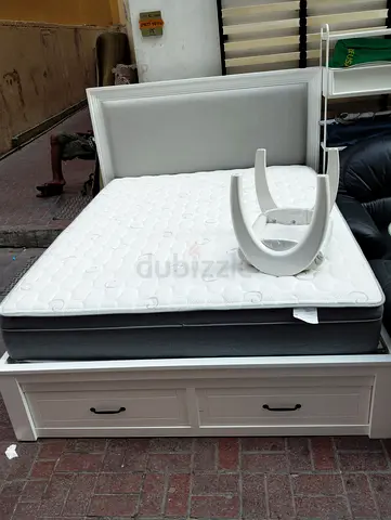 White wooden storage bed with mattress and headboard - good condition