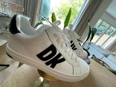 White DKNY-style casual sneakers, used once. Size 37.5 EU.