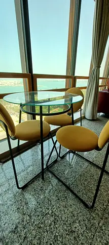 Glass Top Coffee Table with 3 Yellow Chairs - Good Condition