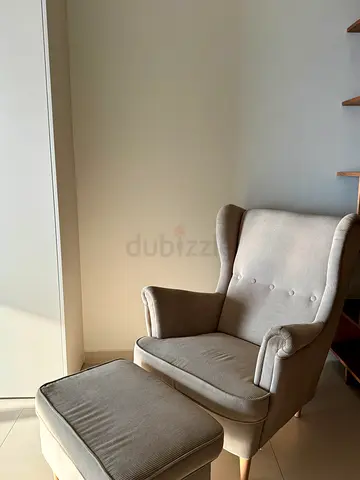 Cozy Armchair with Footstool for Relaxing Evenings