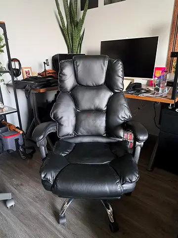 Black leather reclining office chair with footrest — good condition