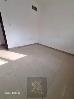 For annual rent in Al Butina, Sharjah, apartment 306 with a spacious one bedroom and living room, on