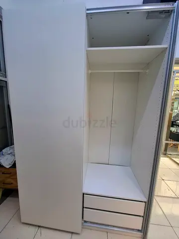 White modular shelving unit / wardrobe organizer with multiple compartments