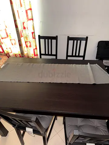 Dark wood dining table with 4 matching chairs - good condition
