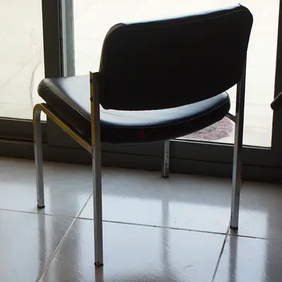 Black Leather Armless Office Chair w/ Metal Frame