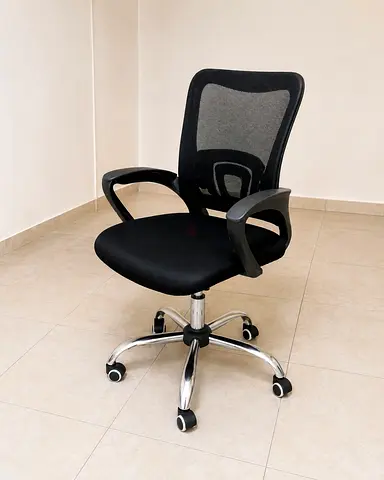 Black mesh ergonomic office chair with armrests and wheels