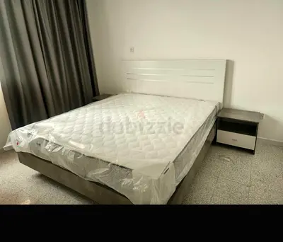 Queen size bed frame with mattress and two bedside tables and wardrobe very good condition