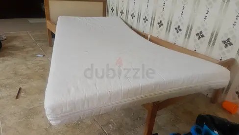 Ikea kids size mattress on wooden bed frame - good condition