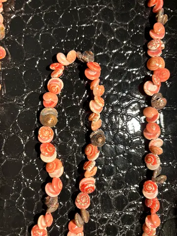 Handmade pink shell necklace — natural spiral shell beads