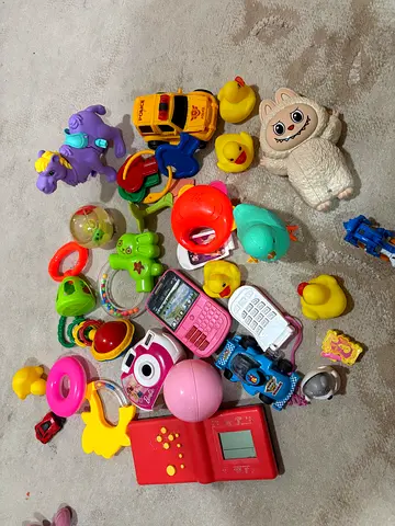 Mixed baby and toddler toys bundle — rattles, bath ducks, teether toys, toy phones