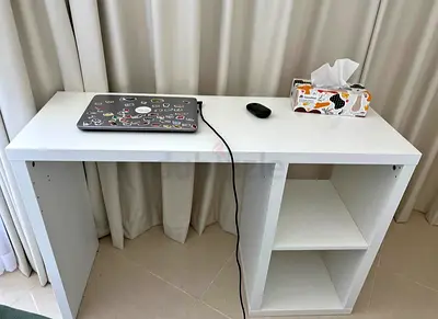 Simple white study desk with open shelving — good condition