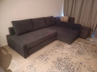 Grey L-shaped sofa with storage, good condition