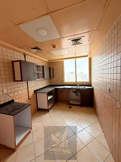 Spacious two bedroom apartment for annual rent in Al Qulaya with balcony 2 bathrooms built in wardro