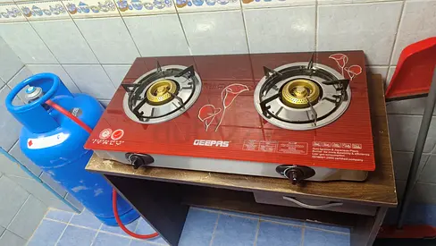 Geepas 2-Burner Gas Stove with Medium Adnoc Gas Cylinder - Good Working Condition