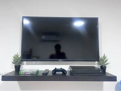 XBOX ONE X & 42’ TCL TV & TV STAND & 2 GAMES