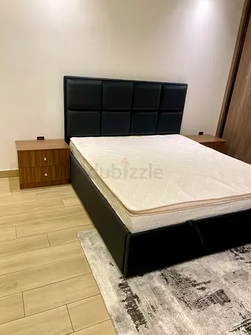 Queen size black fabrichheadboard and bed base