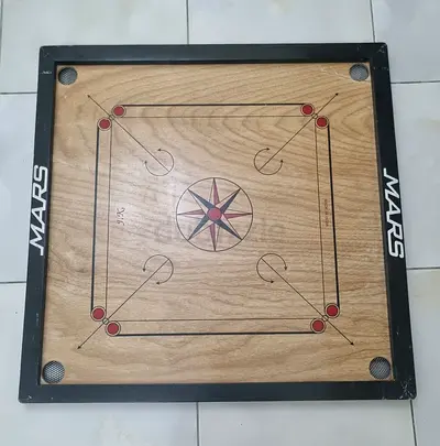 Carrom board with coins
