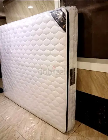 Brand new queen mattress wrapped in plastic - unused