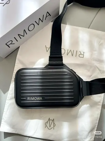 Black RIMOWA PERSONAL ALUMINIUM sling clutch