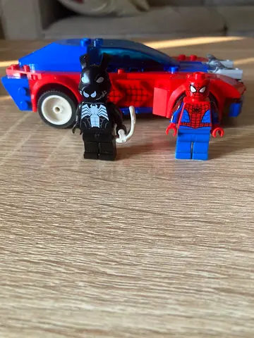 Spider-Man and Venom minifigures with red & blue toy car (used)