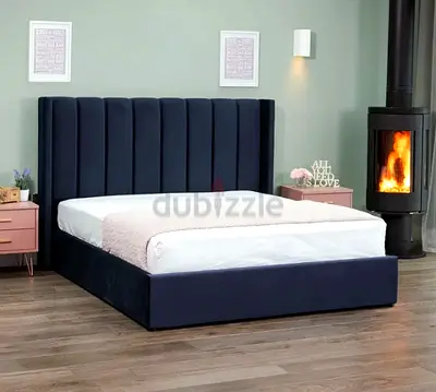 Queen upholstered bed frame with tall vertical channel headboard - dark blue