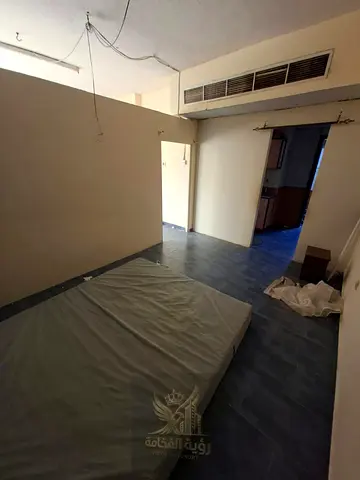 Large spacious studio for annual rent in Al Nabba with central AC and separate kitchen AED 20000 payment in 4 or 6 installments