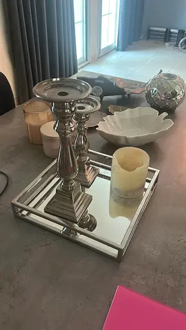 Silver mirrored tray with decorative candle holders and home accents