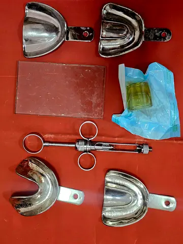 Dental impression trays and syringe set (used, usable)