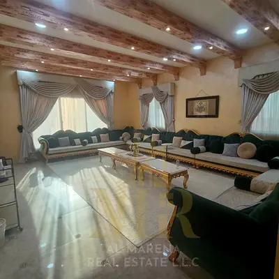 Villa for sale in Al Rawda 3 area, corner lot, price includes electricity, water, and air conditioning. Prime location with a spacious area. Freehold