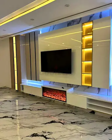 Modern wall-mounted entertainment unit with LED lighting and electric fireplace