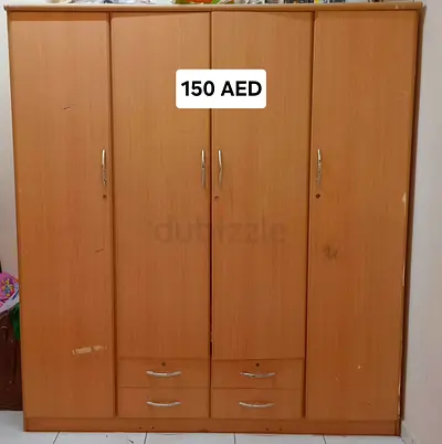 Used 4-Door Wooden Wardrobe with Drawers – Good for Storage, AED 150