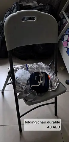 Used folding chair — sturdy and compact (AED 40)