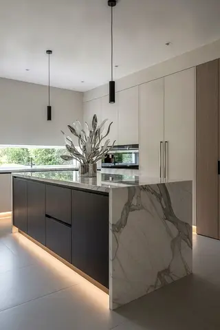 Modern kitchen island with marble ends and integrated storage