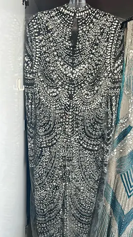 Long heavily beaded evening gowns- black, blue with silver embellishments