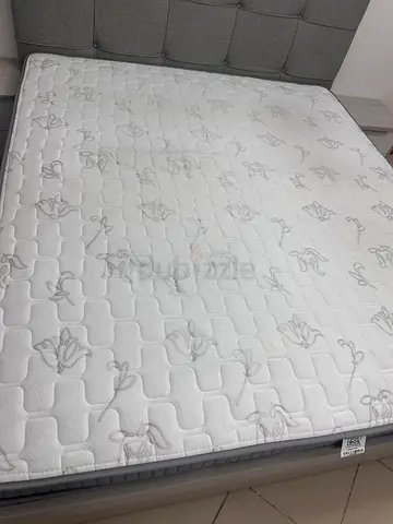 King size mattress in good condition with grey upholstered bed b