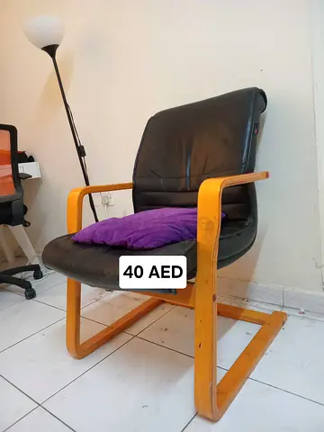 Black leather armchair with wooden frame - good condition, AED 40