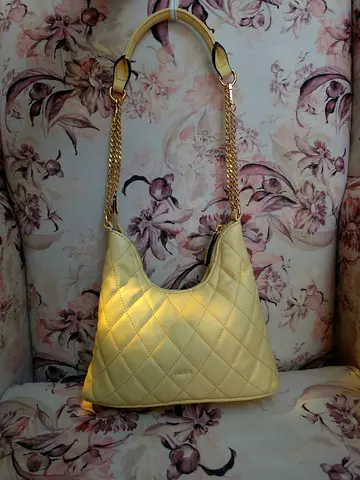 Cream quilted shoulder bag with gold chain straps