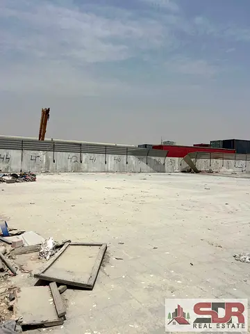 **20,000 Sq Ft Open Yard with 2 shops for Rent – Sajaa Industrial Area, Sharjah | AED 260,000/Year*