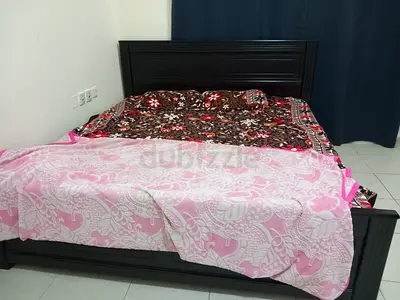 Dark wood double bed frame with headboard (Good condition) King size