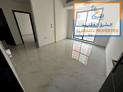 Two-bedroom apartment with a living room, first occupancy, on Ajman Corniche, with high-end finishes and a large area.