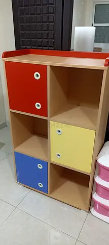 Colorful 6-Cubby Storage Shelf with Doors - Good Condition