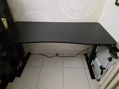 Black height-adjustable standing desk (good condition) and chair